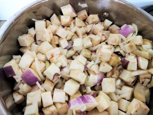 Eggplant and onion cooking on the stove - Eggplant Chutney Recipe