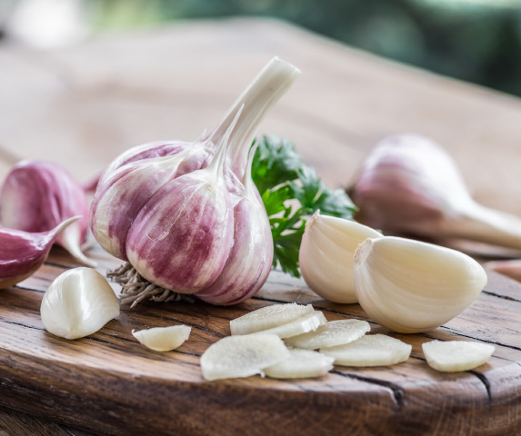 Garlic bulb and garlic cloves on the wooden table
